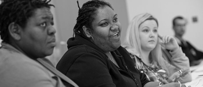 Women talking in a classroom