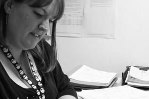 Maria working at her desk