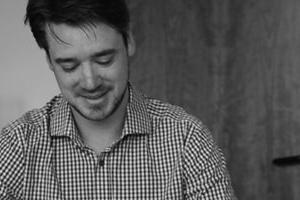 Two people reading at a desk