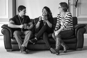 Three people on a sofa