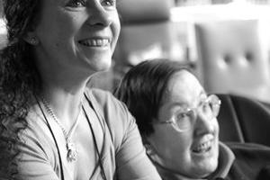 Carer and person who needs care and support playing on the Nintendo Wii