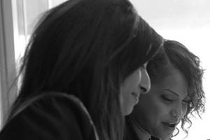 Two apprentices at a desk working