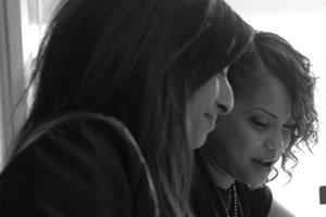 Two apprentices at a desk working