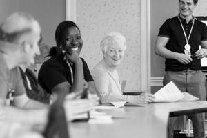 Care workers learning in a classroom