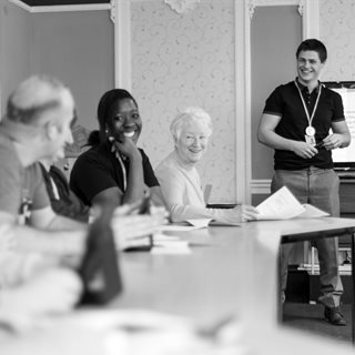 Care workers learning in a classroom