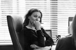 Two women talking at a desk