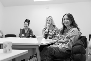 Three women around table
