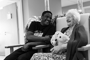 One man and one woman sat down smiling