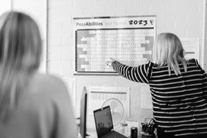 woman points to calendar