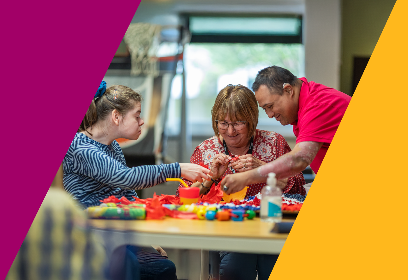 care workers and residents working together on a craft project